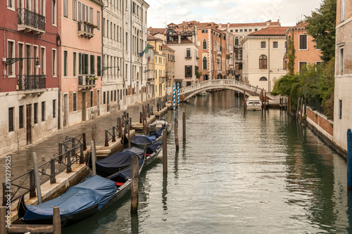 Alley view with historical buildings in Venice, Italy.