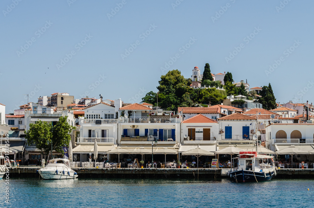 Evia island, Greece - June 28. 2020: Panorama of the tourist island of Skiathos in Greece Evia island, Greece - June 28. 2020: Panorama of the tourist island of Skiathos in Greece