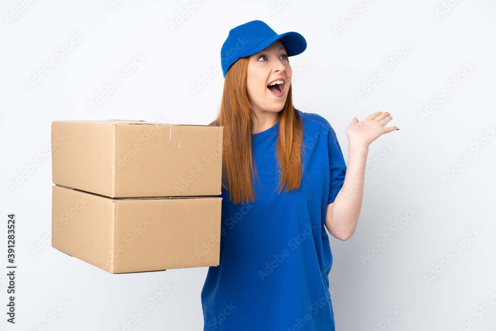 Young delivery woman over isolated white background with surprise facial expression Young delivery woman over isolated white background with surprise facial expression