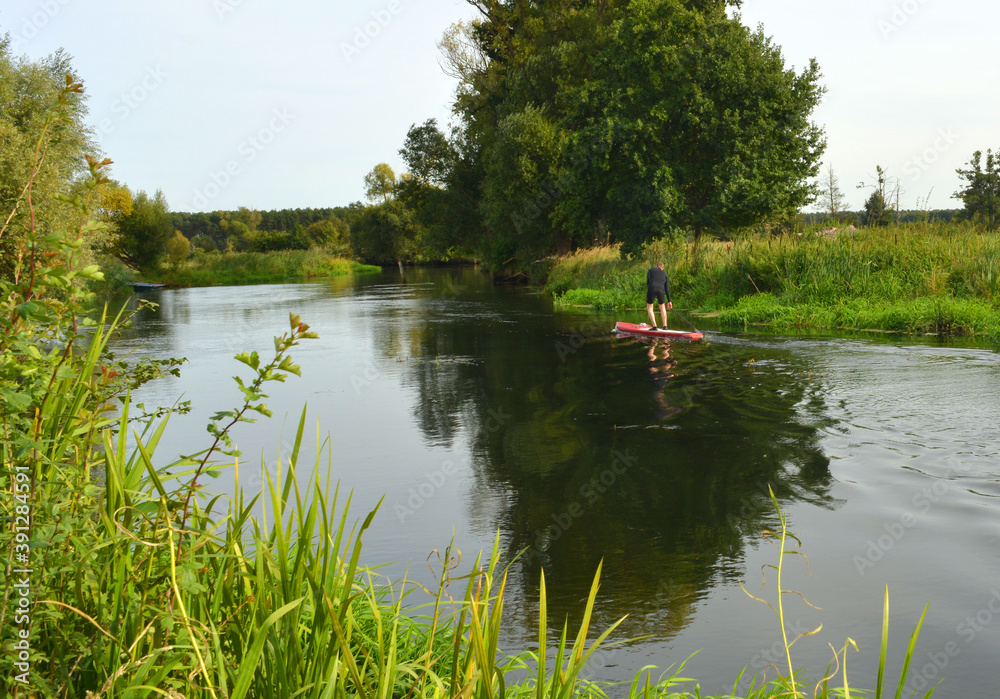 Stand up paddle sport on a river in Germany