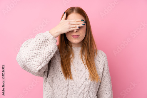 Young redhead woman over isolated pink background covering eyes by hands. Do not want to see something