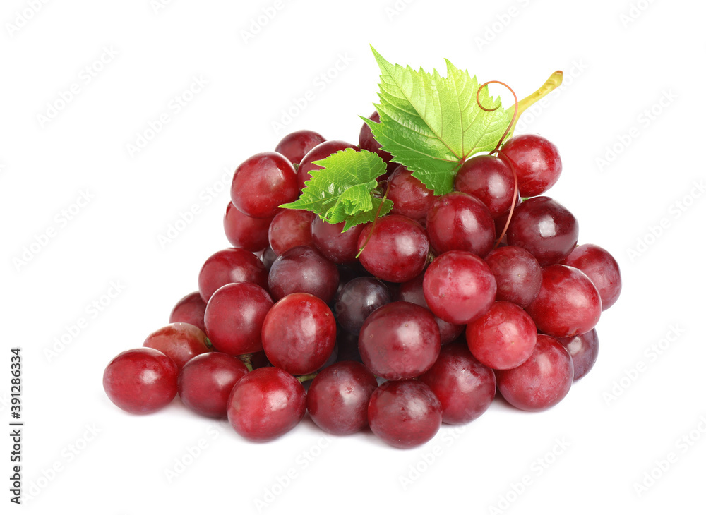 Bunch of fresh ripe juicy red grapes with leaves isolated on white