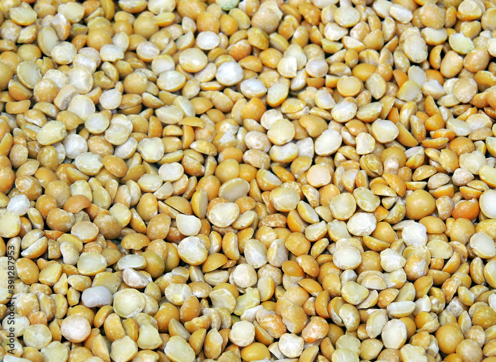 Background of many dried yellow split peas close-up. Background of many dried yellow split peas close-up.