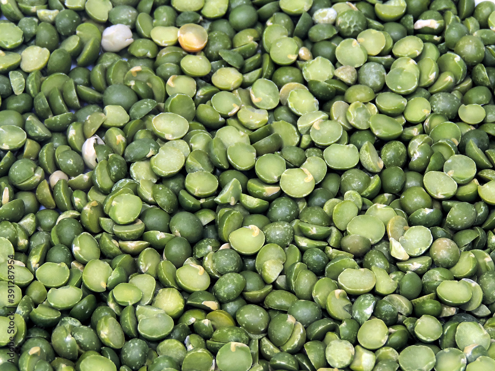 Background of many dried green split peas close-up. Background of many dried green split peas close-up.
