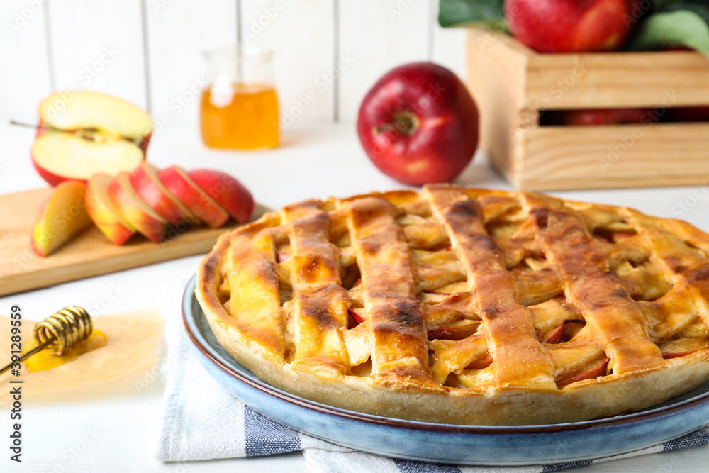Fresh traditional apple pie on white table, closeup