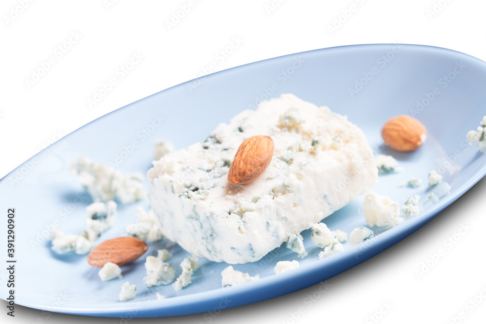 Blue cheese dor blue and almonds on blue plate isolated on white Blue cheese dor blue and almonds on blue plate isolated on white