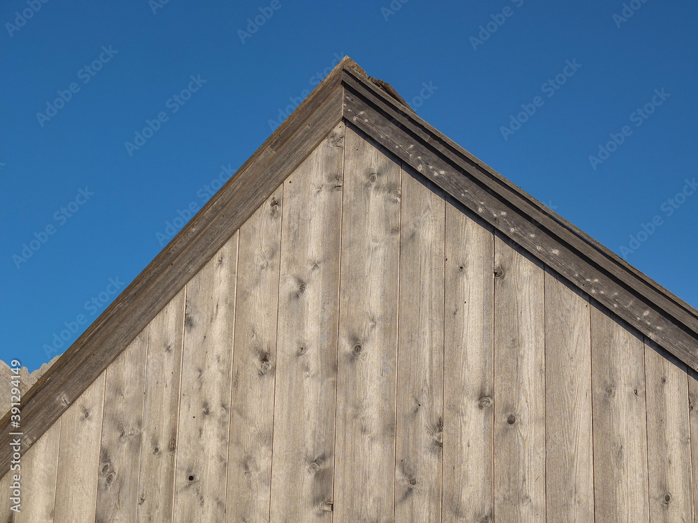 View of a gable of a wooden house.