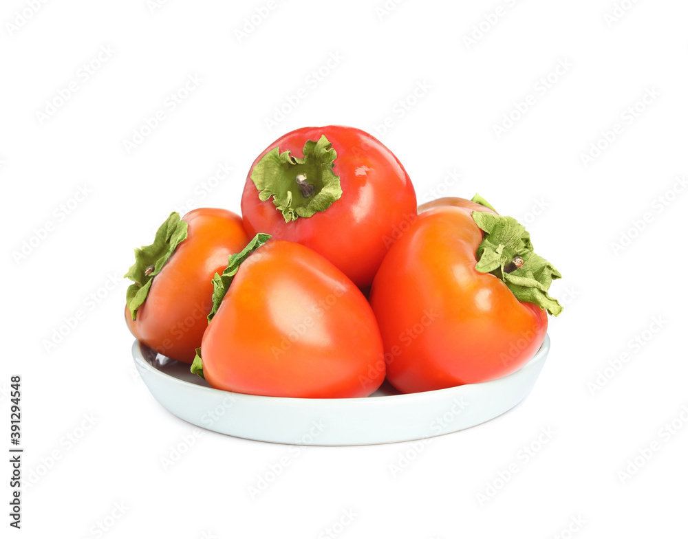 Plate with delicious fresh persimmons isolated on white Plate with delicious fresh persimmons isolated on white