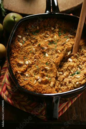 Close up of Thanksgiving side dish with pine nuts