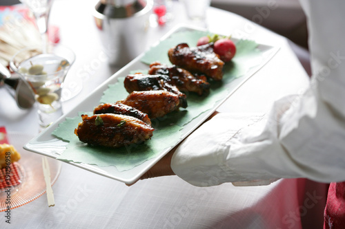 Close up of grilled chicken wings with provencal flavors photo