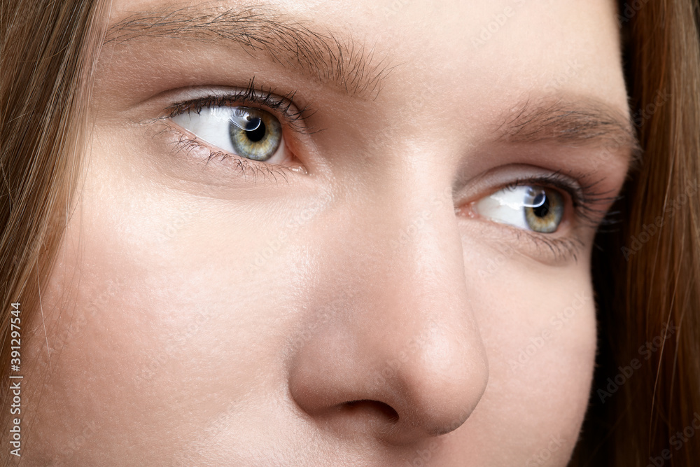 Closeup macro shot of human female face. Closeup macro shot of human female face.