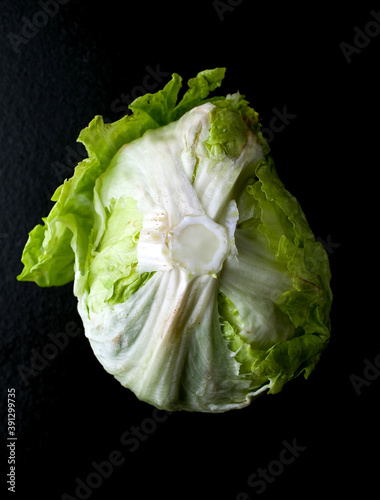 Close up of iceberg lettuce on black background