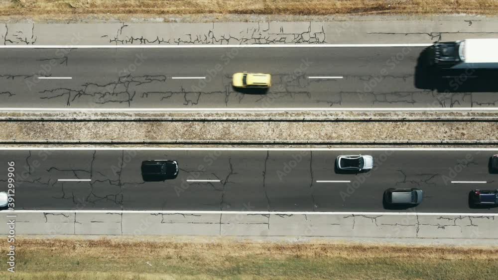 Large highway congestion due to a serious car accident of several cars on a hot summer day aerial view. The flow of cars on the track. The problem is on the road. Large highway congestion due to a serious car accident of several cars on a hot summer day aerial view. The flow of cars on the track. The problem is on the road.