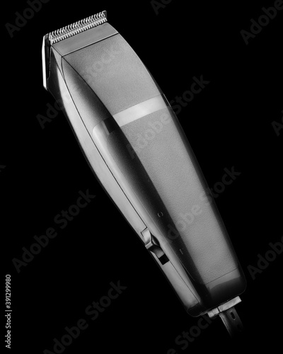 Electric hair clipper isolated on black background
