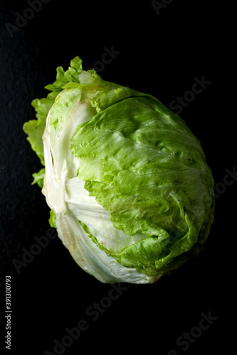 Close up of iceberg lettuce on black background