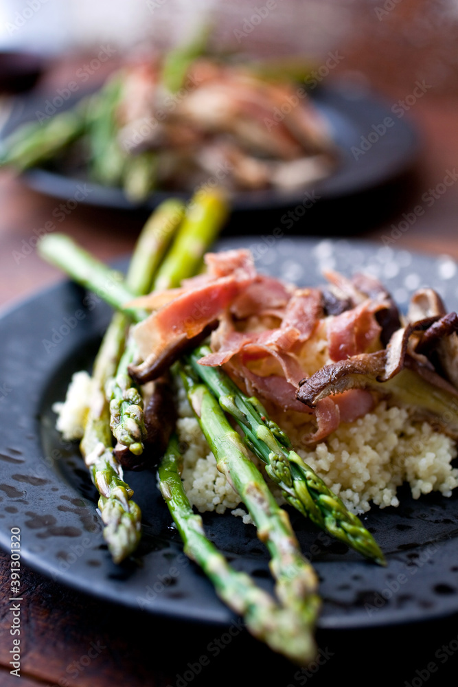 Close up of asparagus bundles with couscous Close up of asparagus bundles with couscous