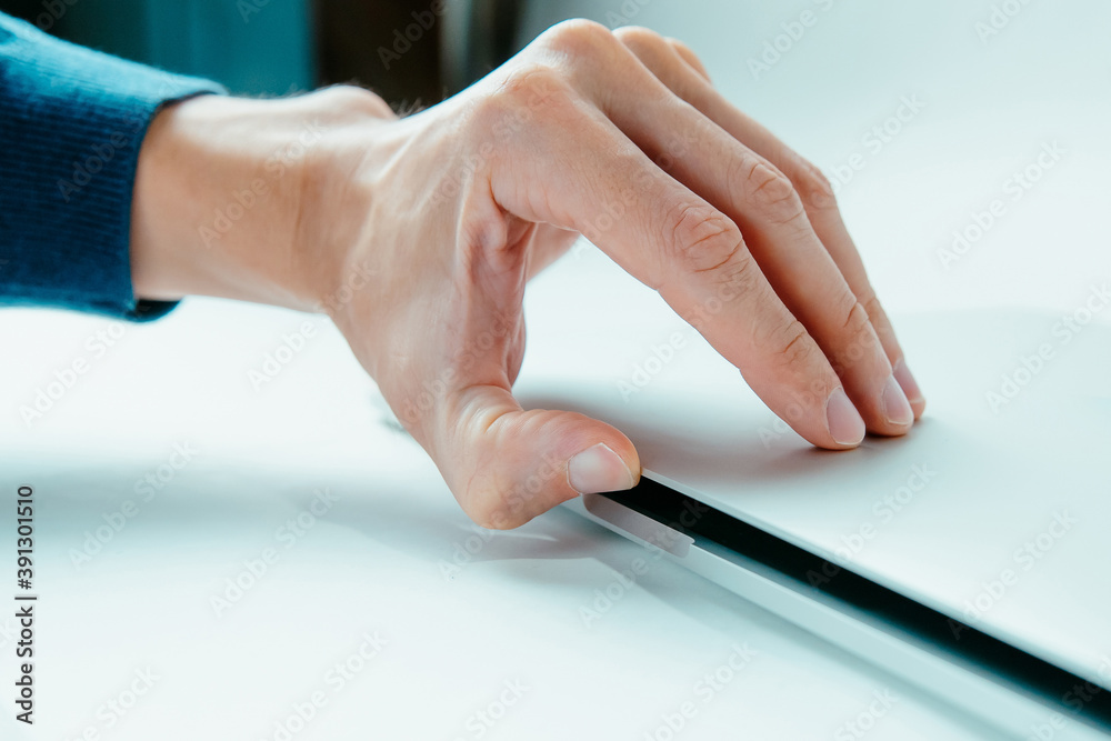 close up. modern man opening his laptop. close up. modern man opening his laptop.