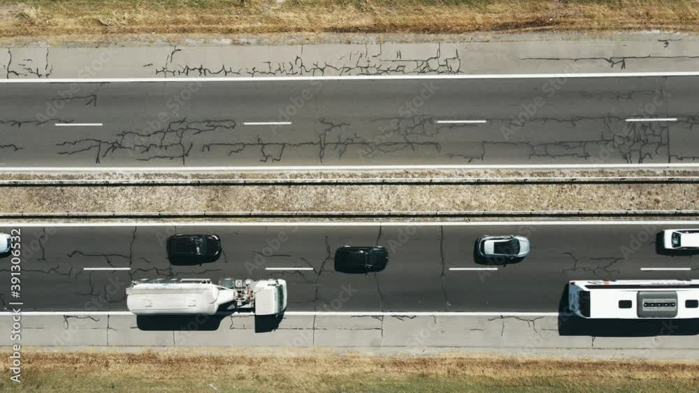Large highway congestion due to a serious car accident of several cars on a hot summer day aerial view. The flow of cars on the track. The problem is on the road. Large highway congestion due to a serious car accident of several cars on a hot summer day aerial view. The flow of cars on the track. The problem is on the road.