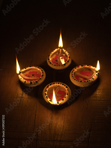 Clay Diya  or lamp with rangoli  stock image.
