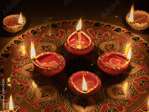 Clay Diya  or lamp with rangoli  stock image. photo