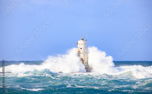lighthouse of the mangiabarche of calasetta in a stormy day, sardinia
