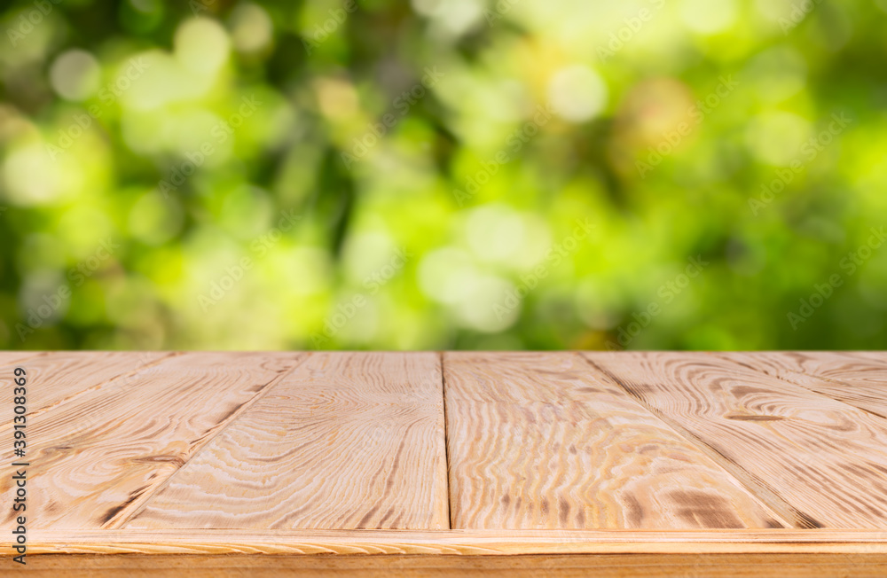 wooden empty table with blurred green garden wooden empty table with blurred green garden