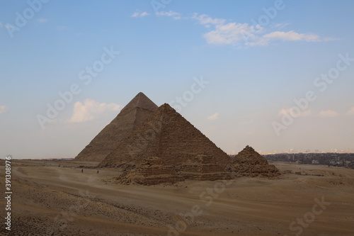 A picture of five of the great historical pyramids of Giza in the light of day  one of the Seven Wonders of the World  Giza - Egypt