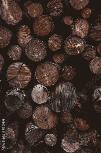 wallpaper of a weathered, dark, dramatic, beautiful old pile of wood before being used to burn in a fireplace