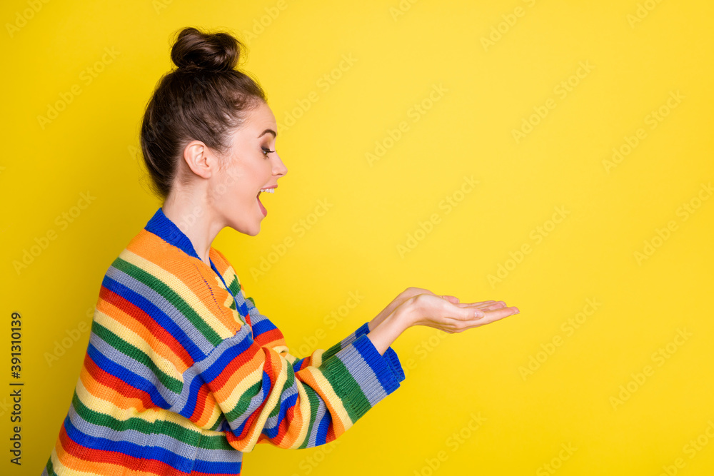 Profile photo of attractive hairstyle person arms hold product open mouth isolated on yellow color background Profile photo of attractive hairstyle person arms hold product open mouth isolated on yellow color background