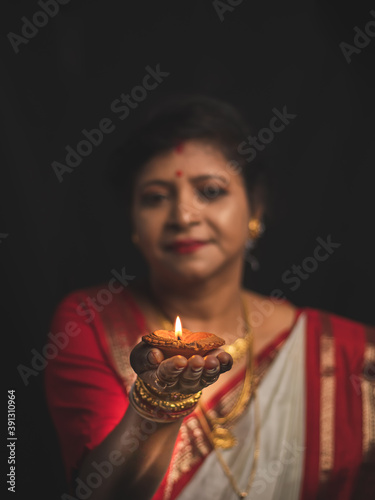 A Woman wearing red and white saree stock image. photo