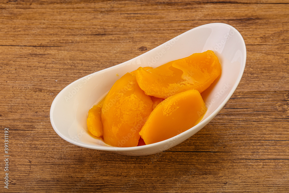 Sweet mango slices in syrop Sweet mango slices in syrop