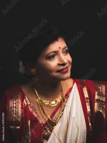 A Woman wearing red and white saree stock image. photo