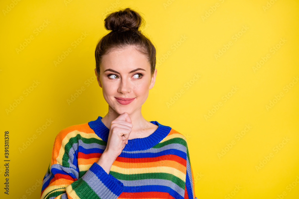 Photo of young happy positive beautiful girl think dream wondered hand touch chin look empty space isolated over yellow color background Photo of young happy positive beautiful girl think dream wondered hand touch chin look empty space isolated over yellow color background