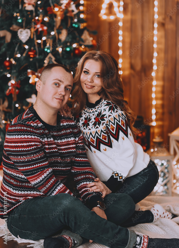 couple in love near the christmas tree
