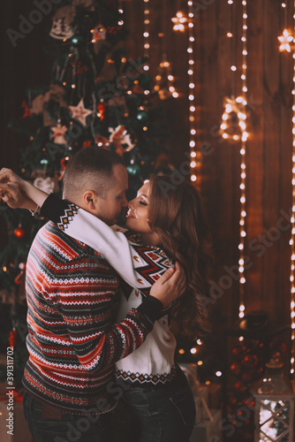 couple in love near the christmas tree