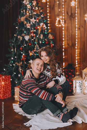 couple in love near the christmas tree © Mikhaylovskiy 