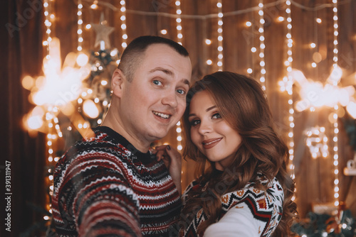 couple in love near the christmas tree