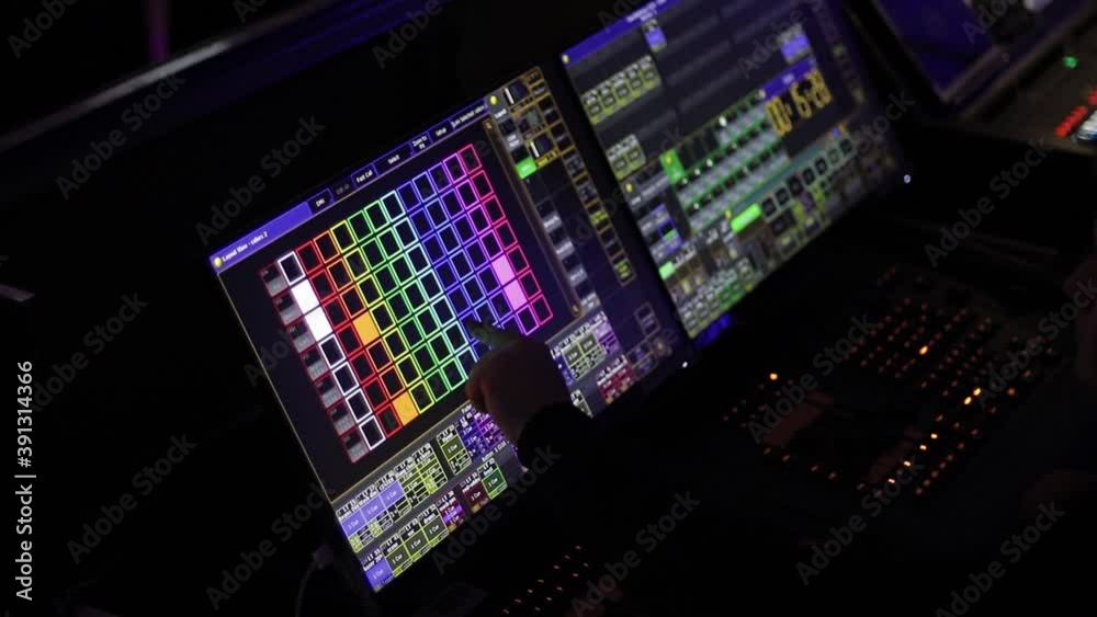 Audio mix desk at a concert. Man working on professional digital audio channel mixer in studio. Male Dj hands playing set in night club party slow motion