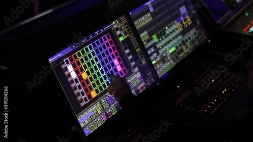 Audio mix desk at a concert. Man working on professional digital audio channel mixer in studio. Male Dj hands playing set in night club party slow motion