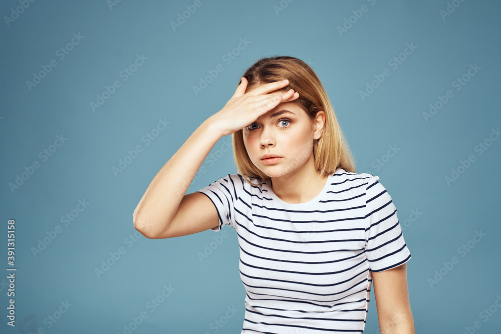Upset woman emotions displeasure gestures with hands blue background Upset woman emotions displeasure gestures with hands blue background