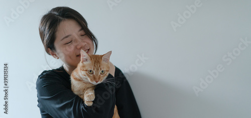 happy woman hugging her cat