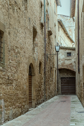 old buildings on narrow lane at historical little town  Pienza  Siena  Italy