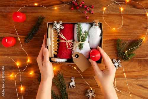 Fotografie Packing homemade seasonal gift box or self care package with bath accessories