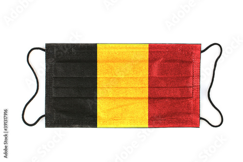 Black medical mask with image of belgian flag. Black medical mask as symbol of mortal danger Covid-19 in Belgium. Close up protective masks filter. High resolution isolated on white background.