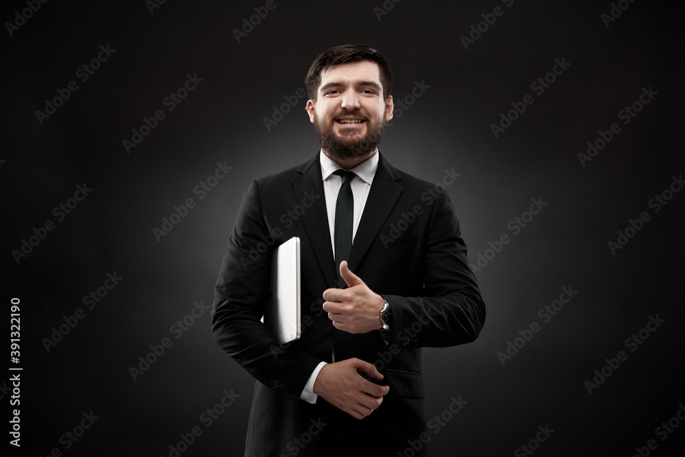 Happy businessman shwoing thumb up, holding laptop Happy businessman shwoing thumb up, holding laptop