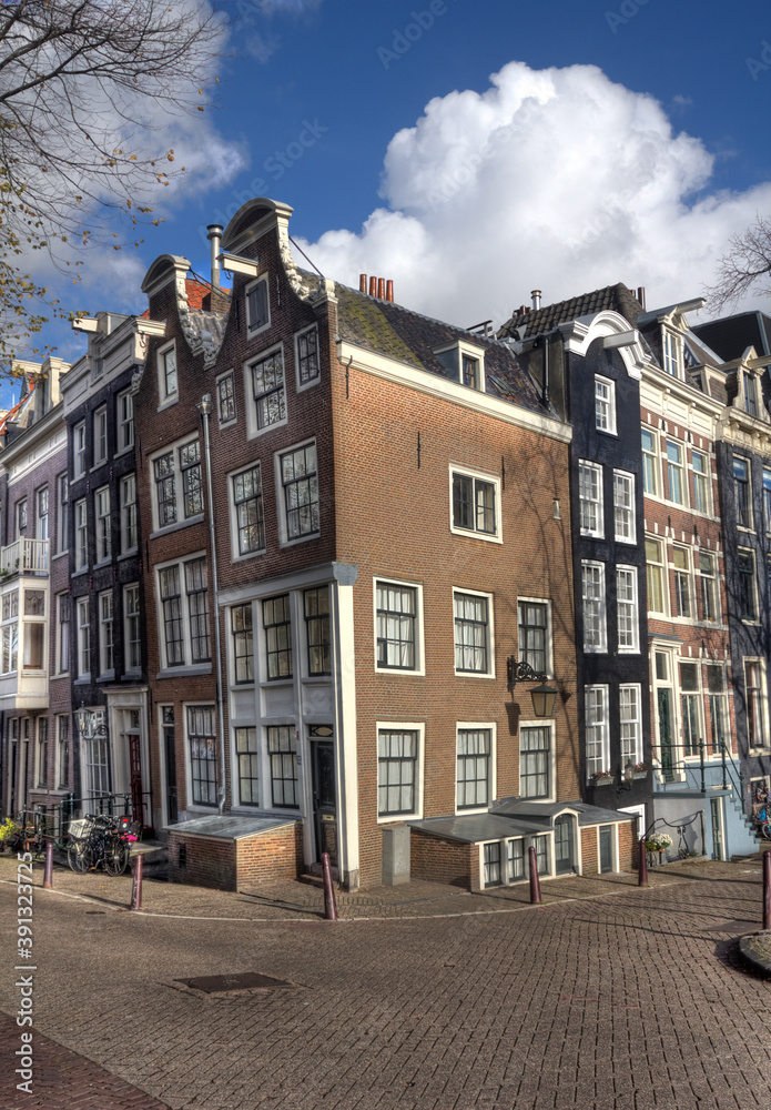 Street with historical  houses iin Amsterdam, Holland