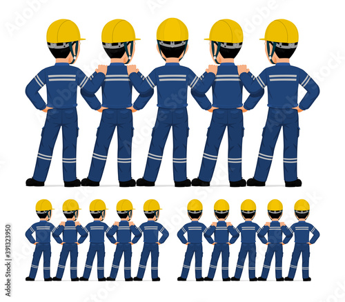 Five industrial workers standing together on white background