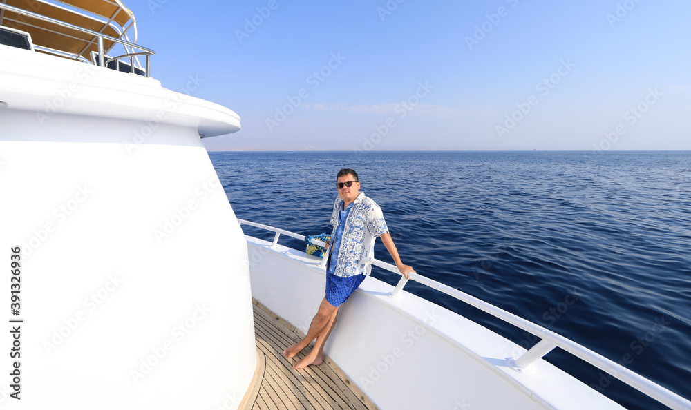 rich businessman resting on a yacht