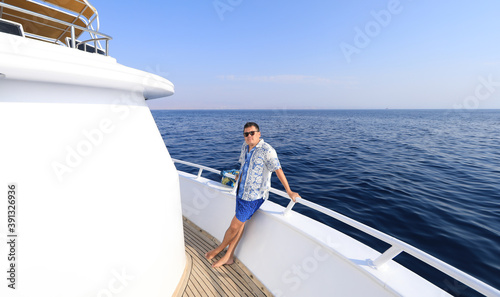 rich businessman resting on a yacht