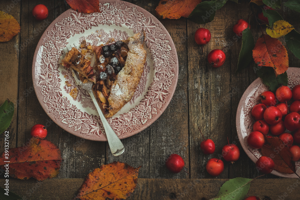A slice of apple galette in autumn styling, flat lay A slice of apple galette in autumn styling, flat lay